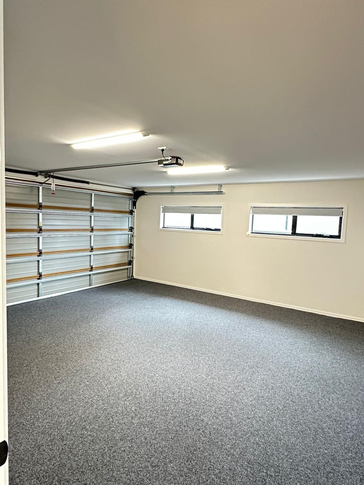 Tidy garage interior with freshly cleaned carpet